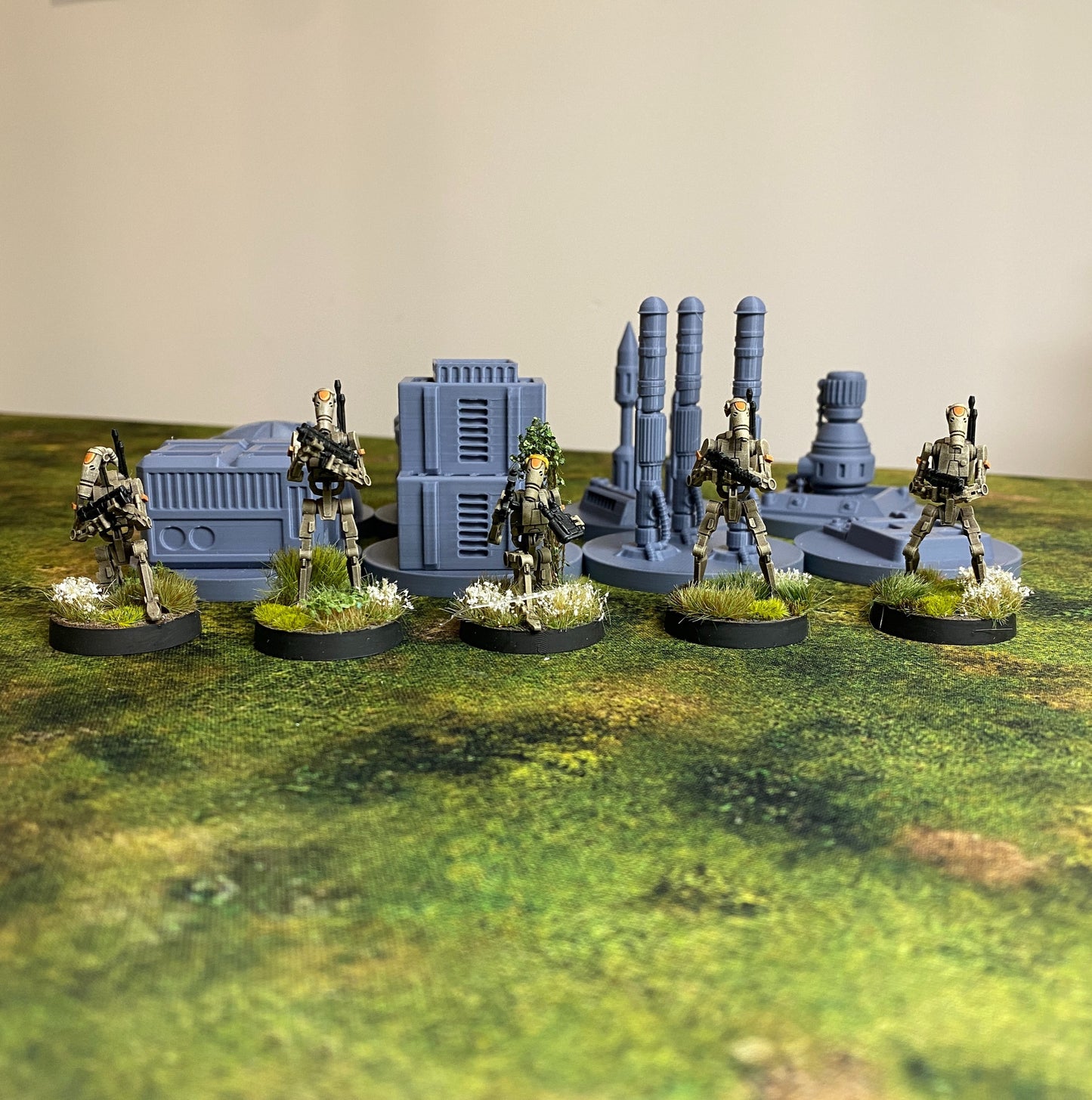 A bunch of B1 droids standing beside poi tokens.