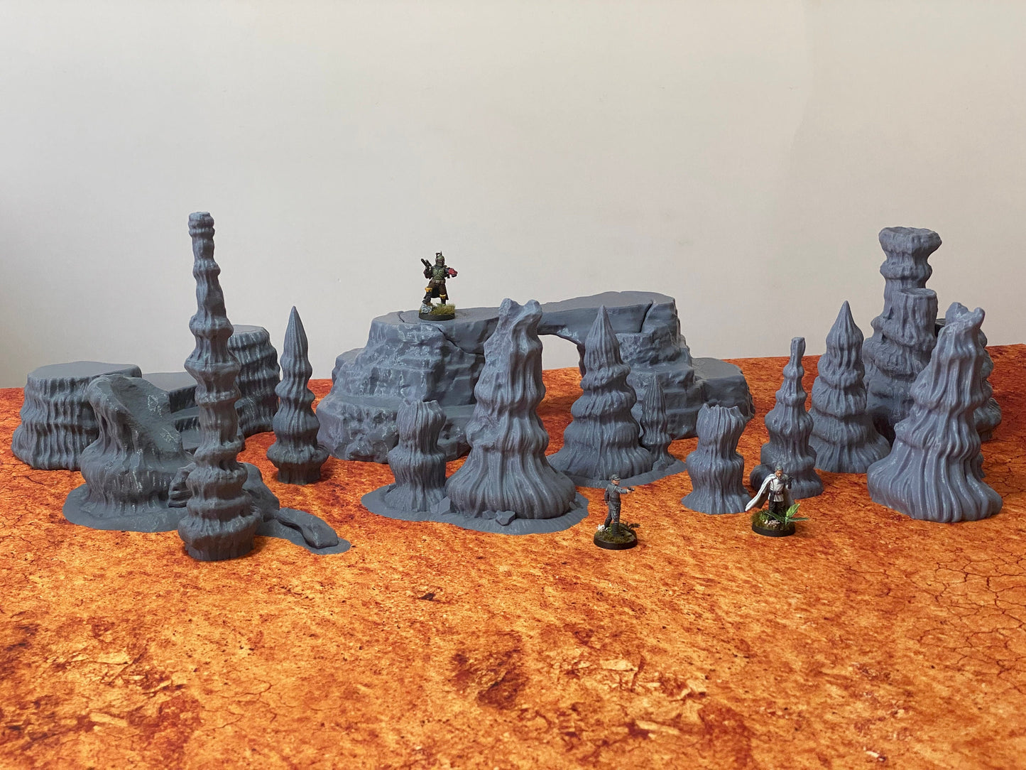 Figure depicting Boba Fett, Krennic and Shoretrooper besides genosian desert rocks