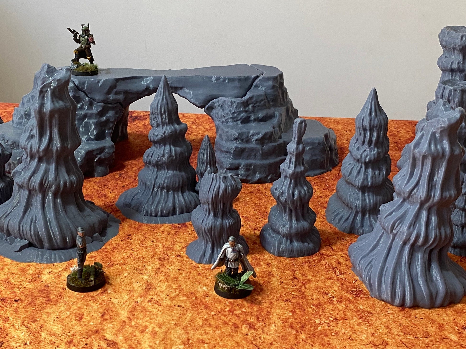Figure depicting Boba Fett, Krennic and Shoretrooper standing on genosian  desert rocks
